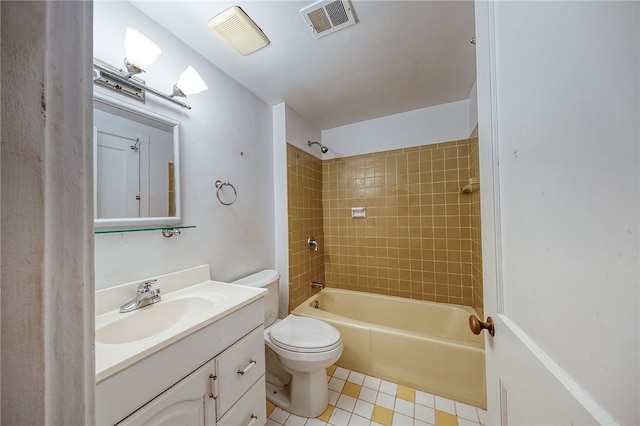 full bathroom with tiled shower / bath combo, toilet, and vanity