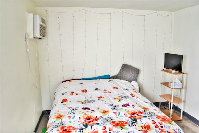 bedroom with a wall unit AC