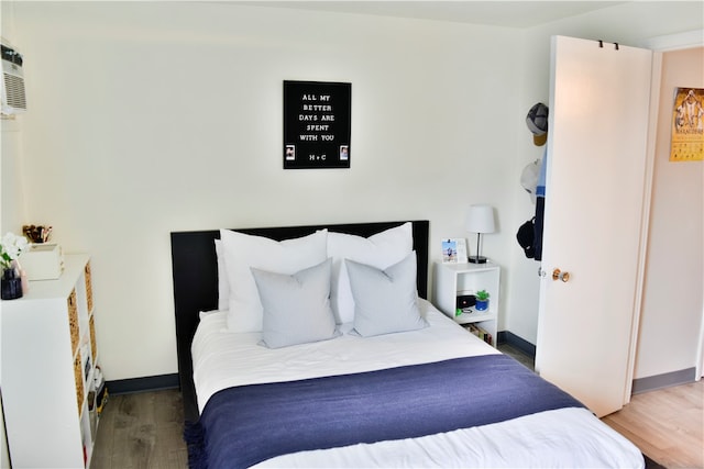 bedroom featuring dark wood-type flooring