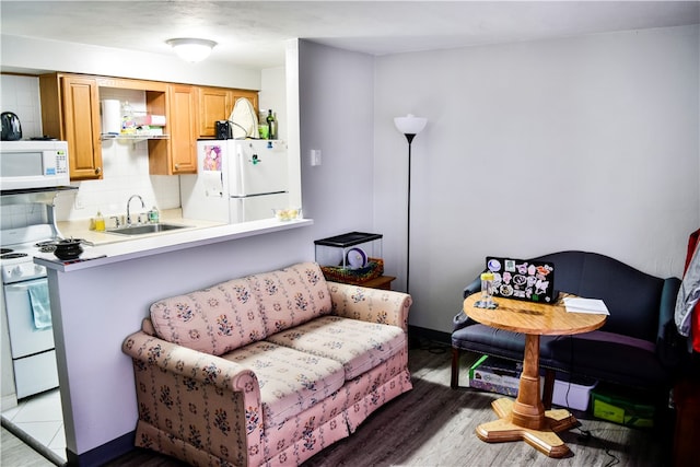 interior space featuring light wood-type flooring and sink