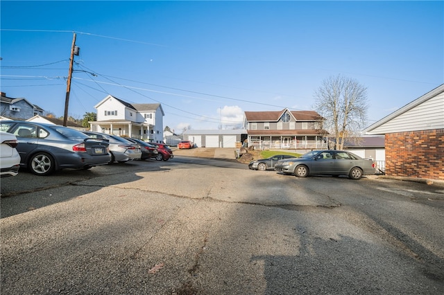 view of vehicle parking with a garage