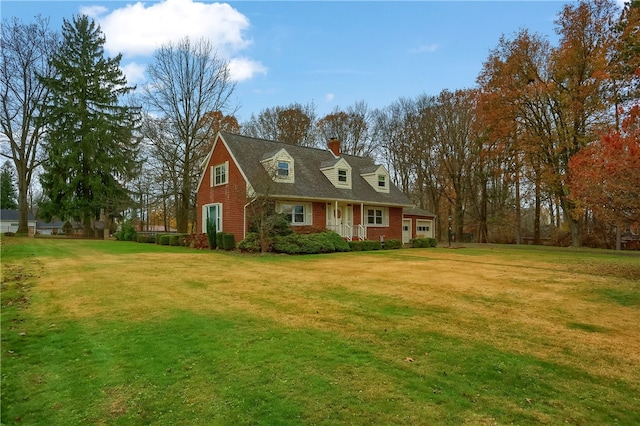 cape cod-style house with a front lawn