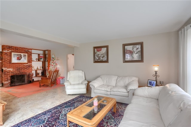 living room featuring a fireplace and carpet