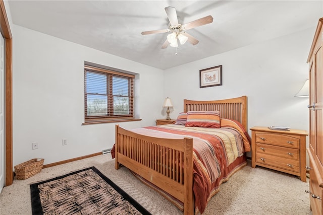 bedroom featuring light carpet and ceiling fan