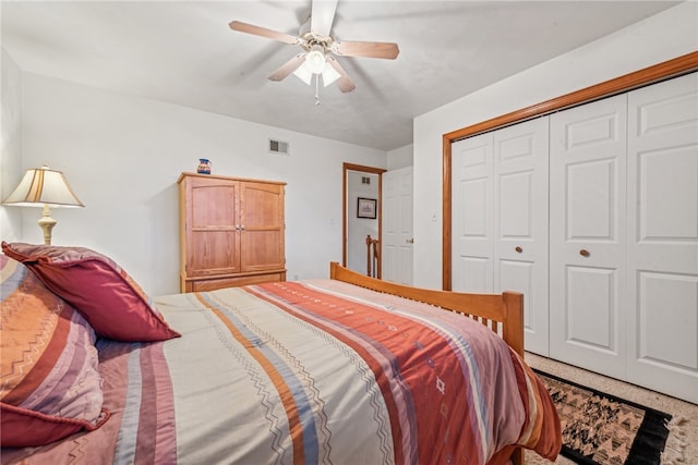 carpeted bedroom with a closet and ceiling fan