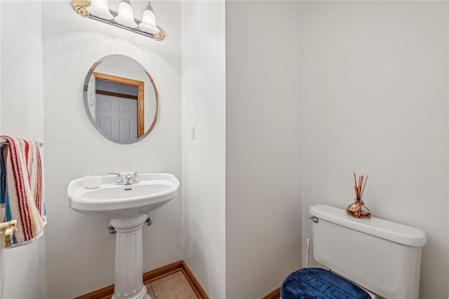 bathroom featuring tile patterned floors and toilet