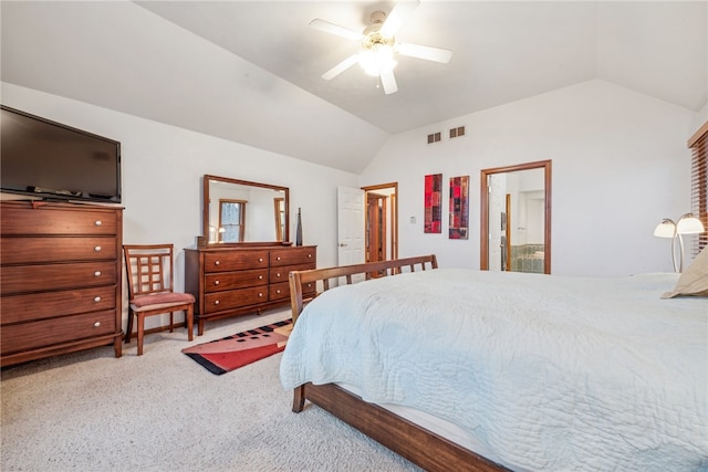 bedroom with carpet floors, ensuite bath, ceiling fan, and lofted ceiling