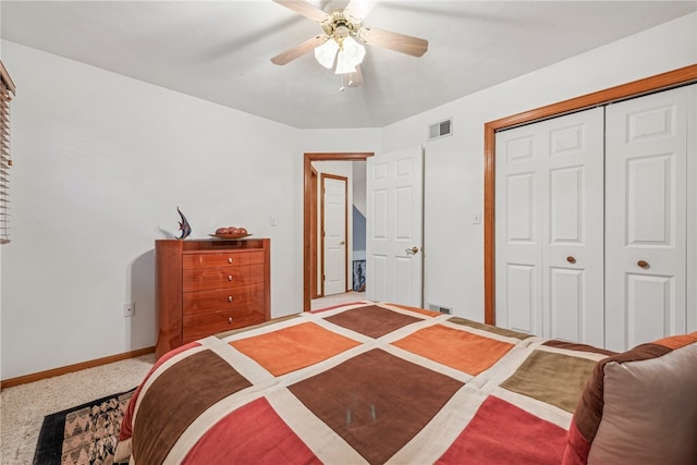 carpeted bedroom featuring a closet and ceiling fan