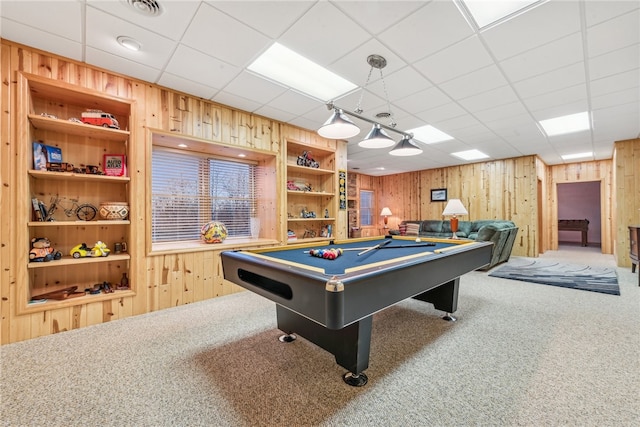 rec room featuring wood walls, a drop ceiling, carpet floors, and billiards