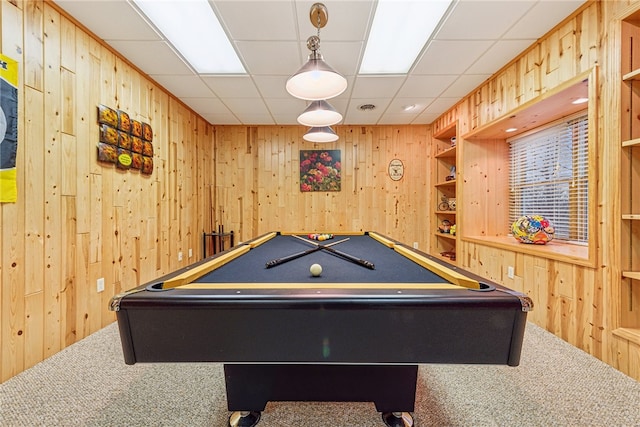 rec room with wooden walls and carpet floors