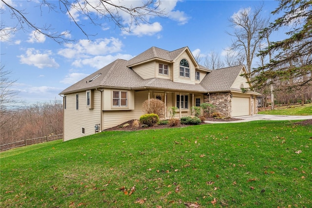 view of front of property featuring a garage and a front lawn