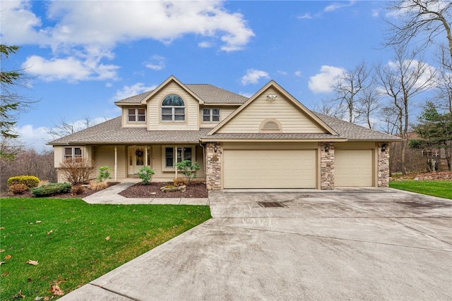 view of front of property featuring covered porch, a garage, and a front yard