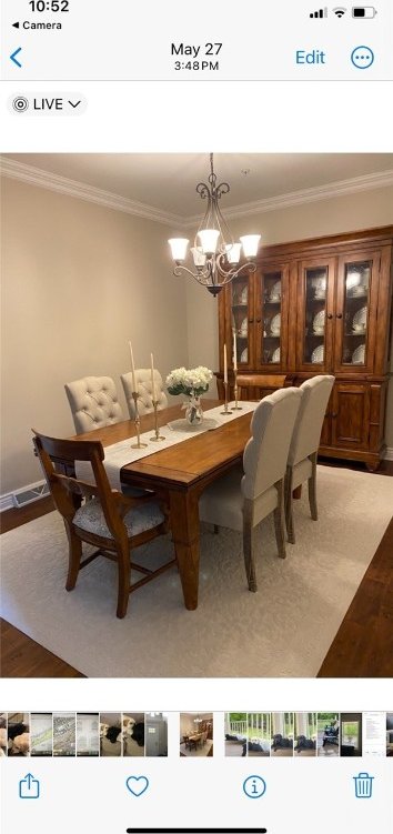 dining room featuring ornamental molding and a notable chandelier