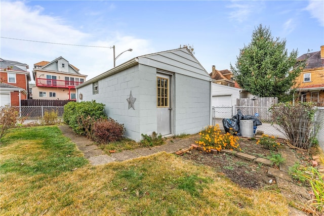 view of outbuilding featuring a lawn