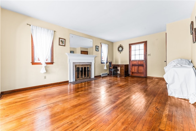 unfurnished living room with hardwood / wood-style floors