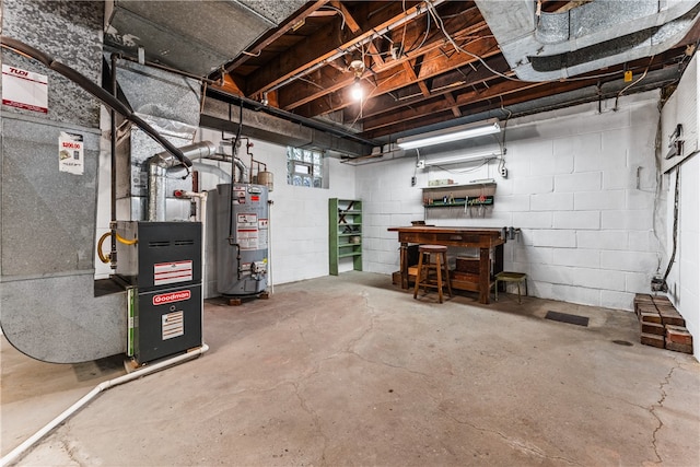 basement with a workshop area and water heater