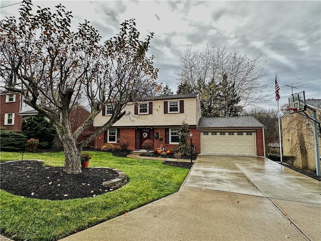 view of front of property with a front yard and a garage