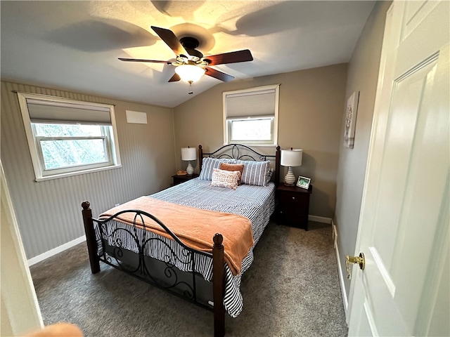 carpeted bedroom featuring ceiling fan, lofted ceiling, and multiple windows