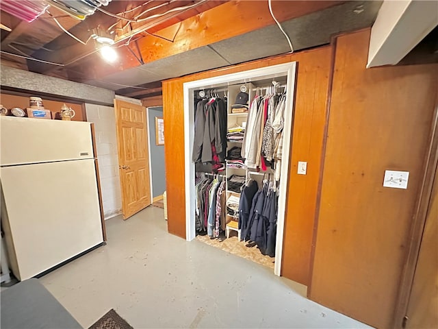 basement featuring white fridge