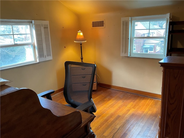 office with light hardwood / wood-style flooring