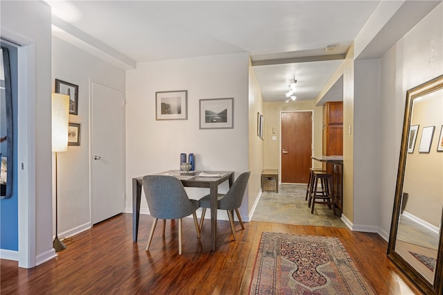 dining space featuring wood-type flooring