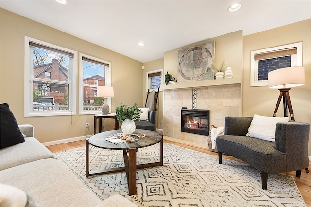 sitting room featuring a fireplace and light wood-type flooring