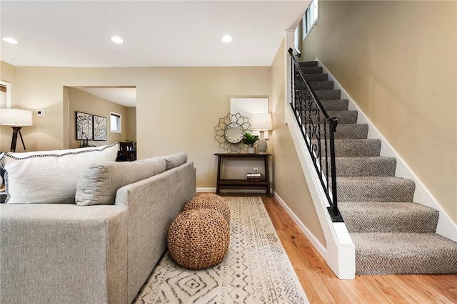 stairway with hardwood / wood-style flooring