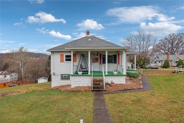 bungalow-style house featuring a porch and a front yard