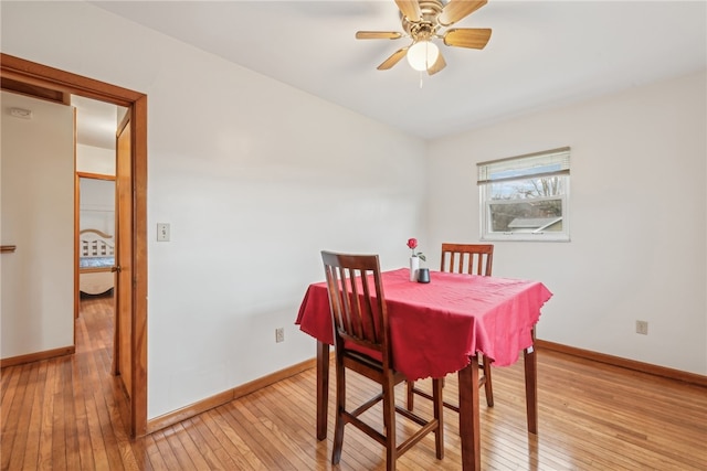 dining space featuring ceiling fan and light hardwood / wood-style flooring