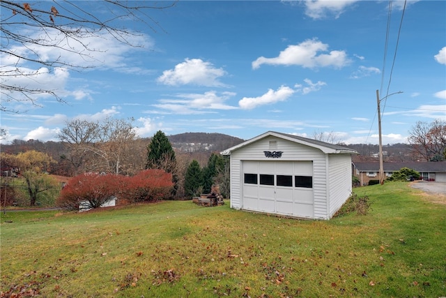 garage featuring a lawn