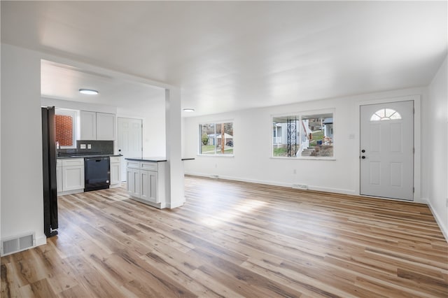 unfurnished living room featuring light hardwood / wood-style floors