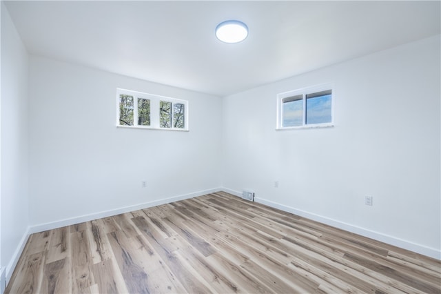 spare room with light hardwood / wood-style floors