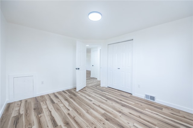 interior space featuring light hardwood / wood-style flooring and a closet