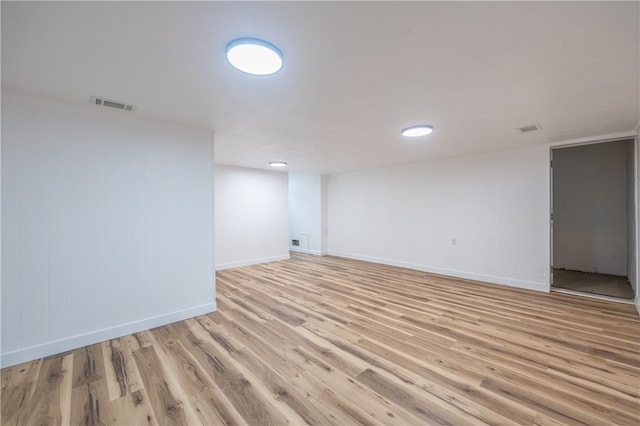 empty room with light hardwood / wood-style floors