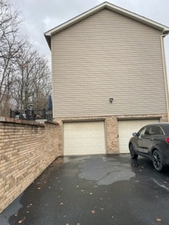 view of side of property featuring a garage