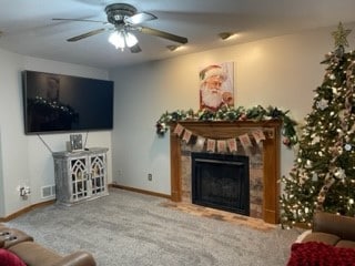 carpeted living room featuring ceiling fan