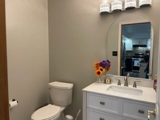 bathroom with vanity and toilet