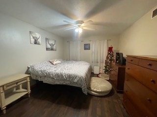 bedroom featuring ceiling fan and dark hardwood / wood-style flooring