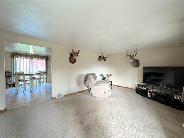 unfurnished living room with carpet flooring