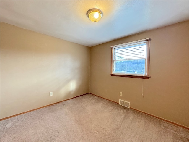 empty room featuring carpet floors