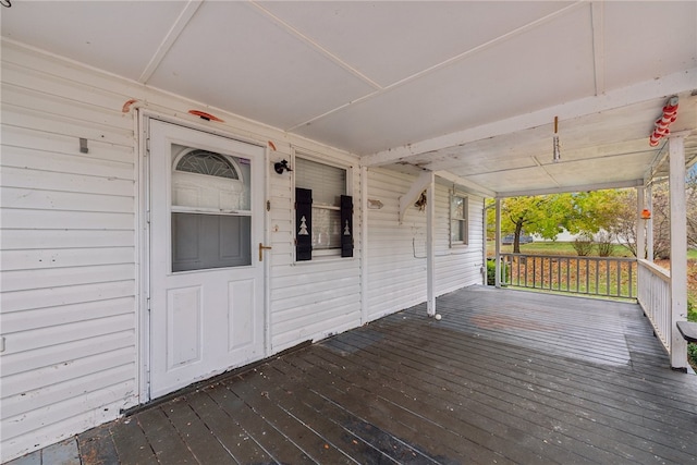 wooden terrace with a porch