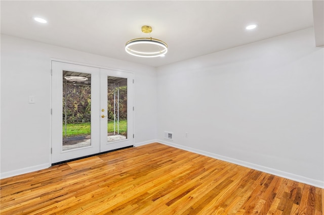 spare room featuring light hardwood / wood-style flooring