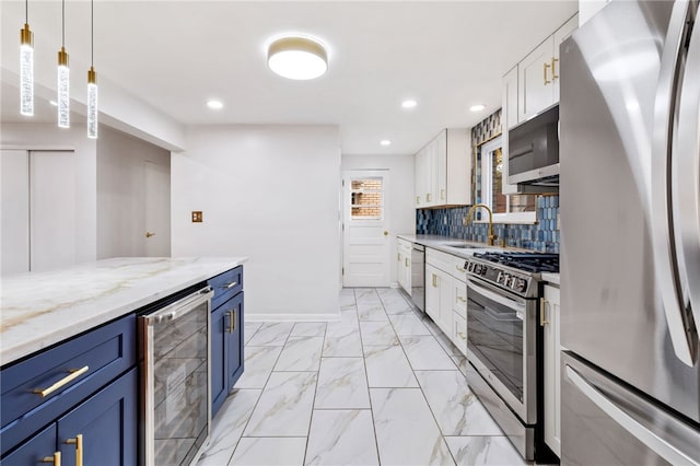 kitchen featuring white cabinetry, sink, beverage cooler, stainless steel appliances, and blue cabinets