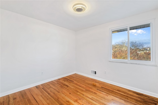 unfurnished room with light hardwood / wood-style floors