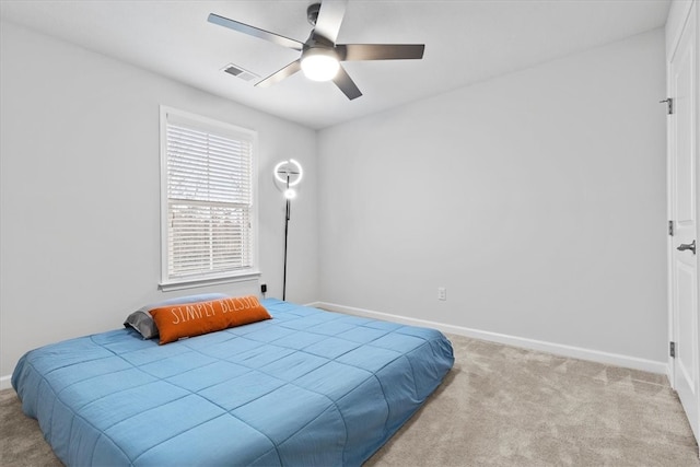 carpeted bedroom featuring ceiling fan