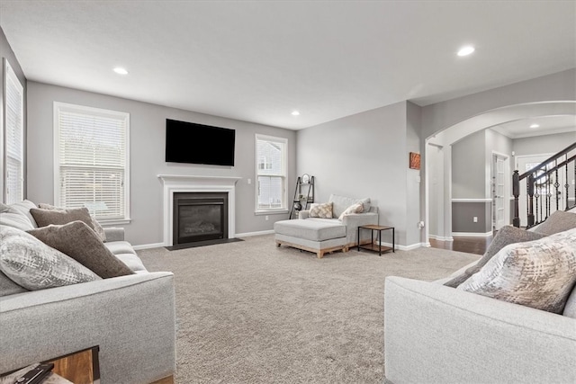 living room with carpet flooring and a wealth of natural light