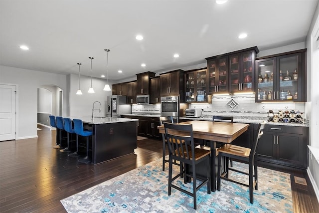 dining space featuring dark hardwood / wood-style floors and sink