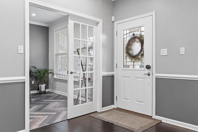 foyer featuring french doors and ornamental molding