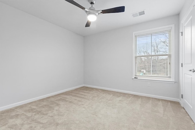 carpeted spare room with ceiling fan and a healthy amount of sunlight