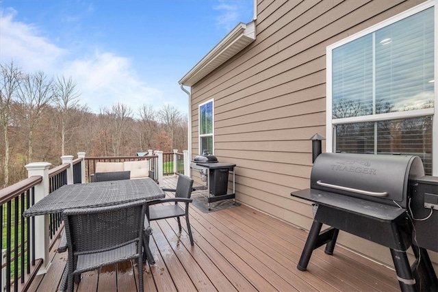 wooden terrace featuring grilling area